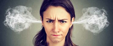 an angry young woman with steam blowing out of her ears