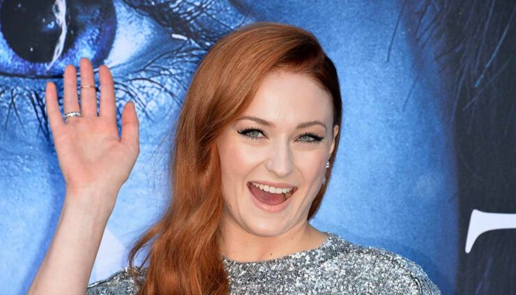 Sophie Turner smiles during the season seven premiere for Game of Thrones