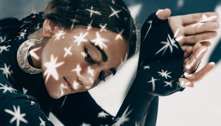 Woman with stars across her face.