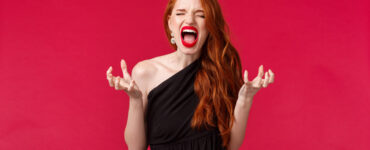 Frustrated woman on red background