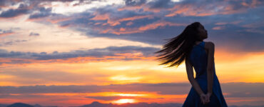 Silhouette of a woman at sunset