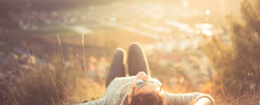 Woman laying in the grass