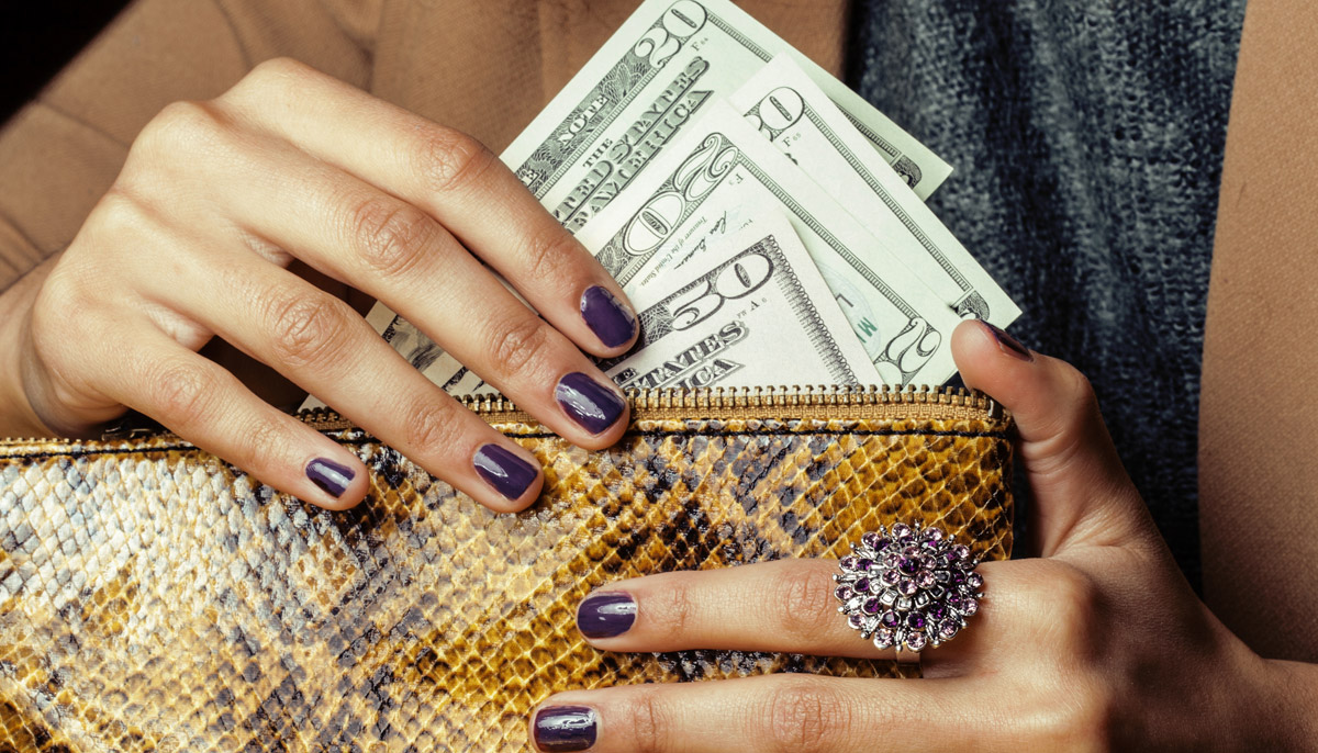 Woman pulling money out of purse