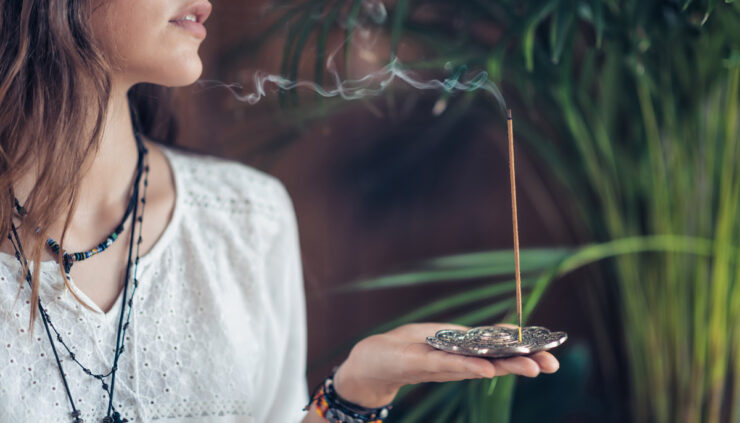 Woman holding incense
