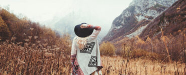 Boho woman looking out into the mist