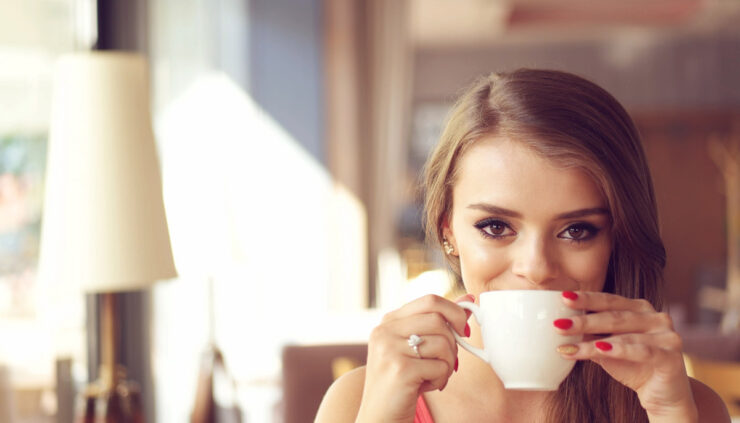 Woman sipping coffee