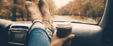 Woman's feet on the dashboard