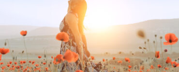 Girl in field of poppies