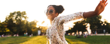 Black woman dancing in a field