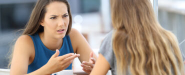 Girls having tense conversation