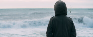 Woman standing in stormy weather