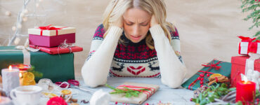 stressed out woman during Christmas gift prep