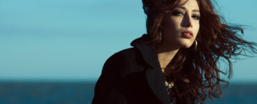 Melancholy woman in front of ocean