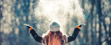 Woman playing in the snow