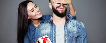 Woman giving man a gift