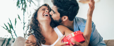 Man giving woman gift on Valentine's Day