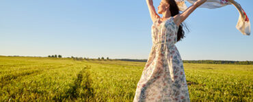 Woman dancing in field