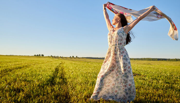 Woman dancing in field