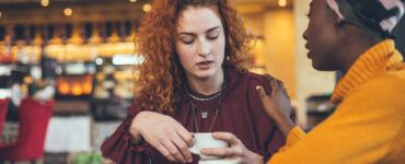 Women talking over coffee